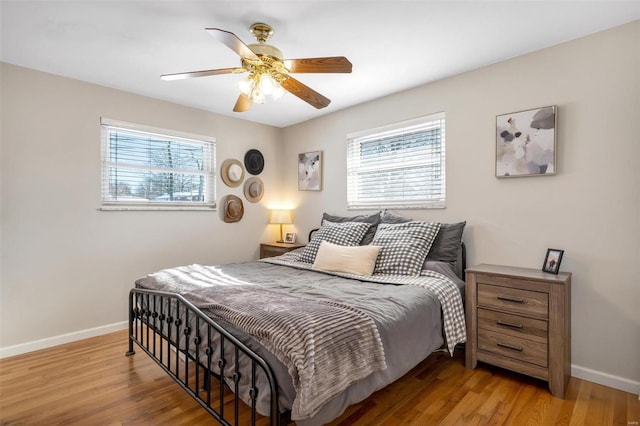 bedroom with light wood-type flooring and ceiling fan