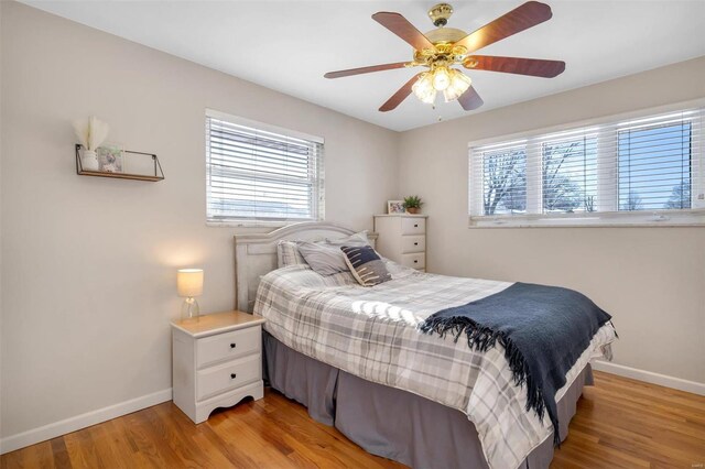 bedroom featuring ceiling fan and light hardwood / wood-style flooring