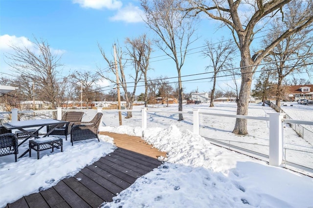 view of snow covered deck