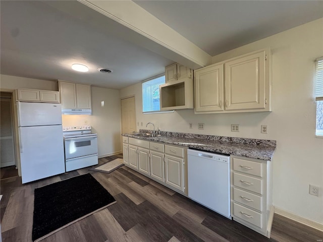 kitchen with white appliances, dark hardwood / wood-style flooring, white cabinets, and sink