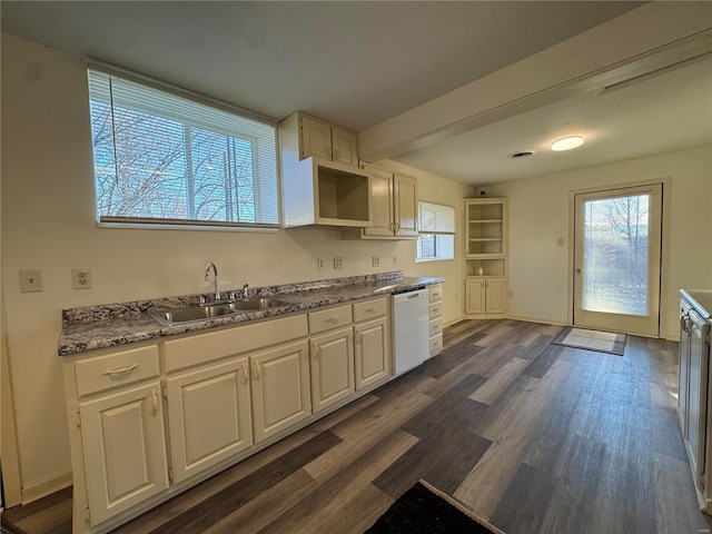 kitchen featuring white dishwasher, white cabinets, dark wood-type flooring, and sink