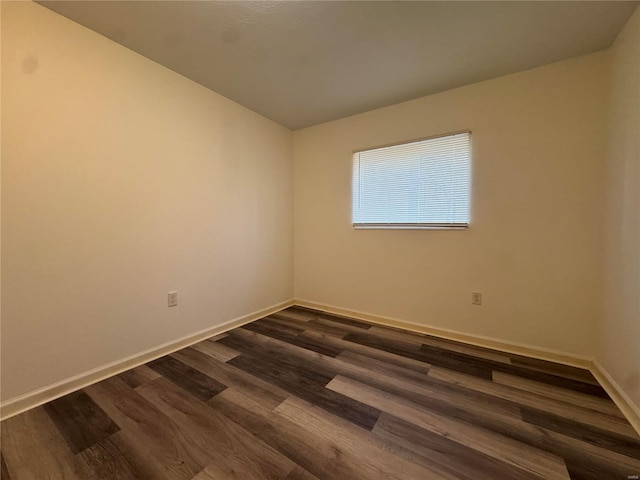 spare room featuring dark hardwood / wood-style flooring