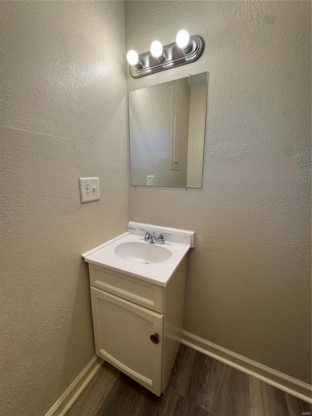 bathroom with wood-type flooring and vanity