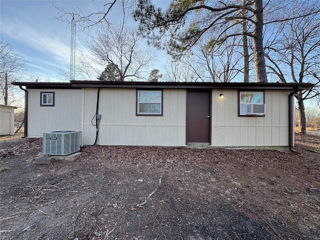 rear view of house with central air condition unit