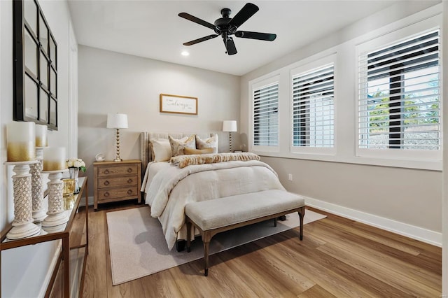 bedroom featuring wood-type flooring and ceiling fan