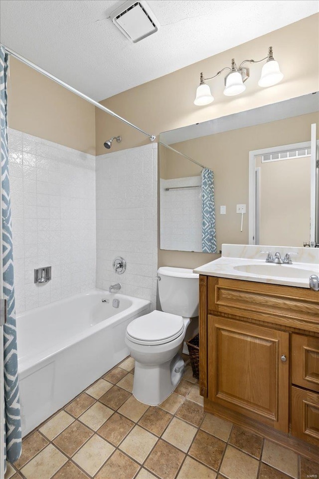 full bathroom featuring vanity, shower / bath combo, a textured ceiling, and toilet