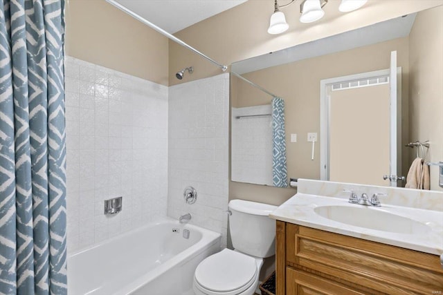 full bathroom featuring vanity, toilet, and shower / tub combo