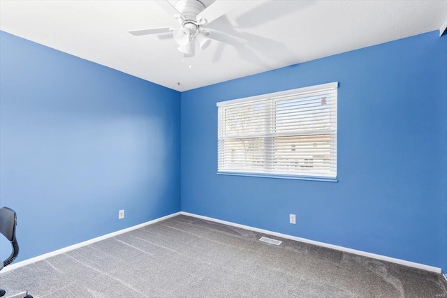 carpeted empty room with ceiling fan