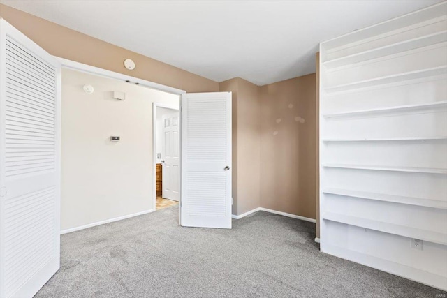 unfurnished room with light colored carpet