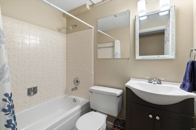 full bathroom with vanity, shower / bath combo, and toilet