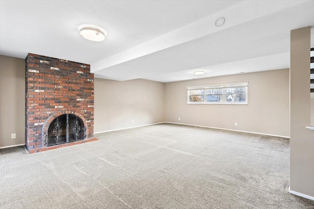 unfurnished living room with a fireplace and carpet