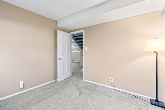 empty room featuring light carpet