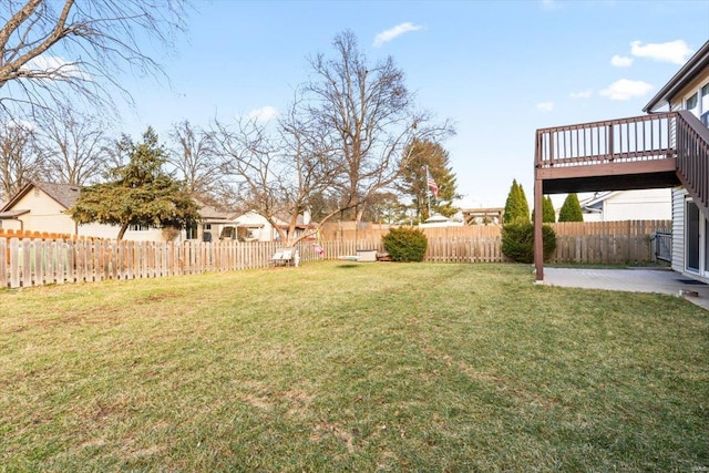 view of yard with a patio area and a wooden deck