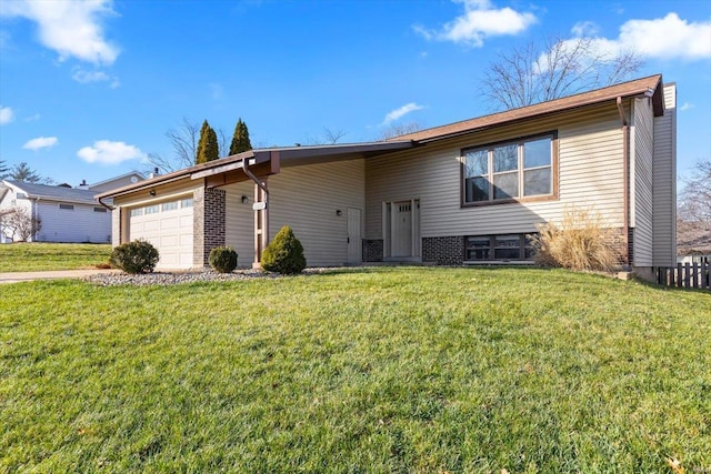 view of front of property with a front yard and a garage