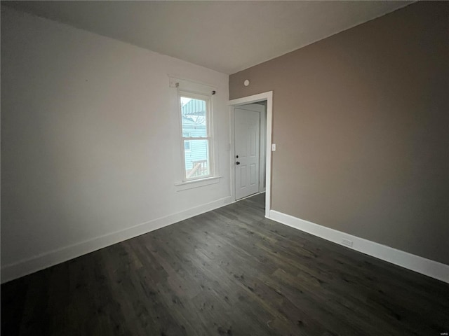 unfurnished room featuring dark hardwood / wood-style floors