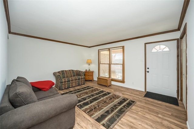 living room with hardwood / wood-style flooring and ornamental molding