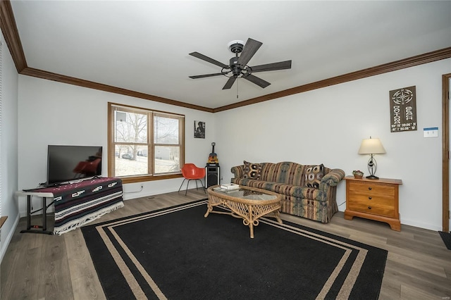 living room featuring crown molding, hardwood / wood-style flooring, and ceiling fan