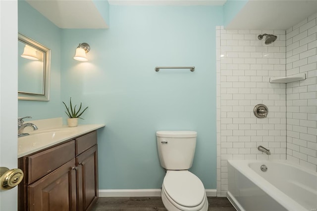 full bathroom featuring vanity, toilet, tiled shower / bath combo, and wood-type flooring