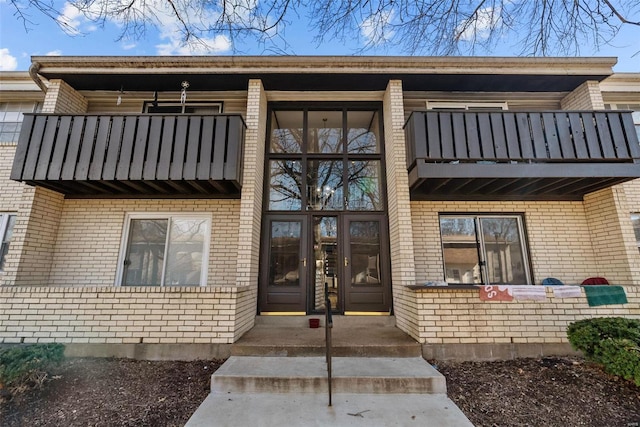 property entrance with a balcony