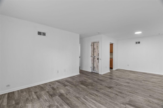 empty room with wood-type flooring