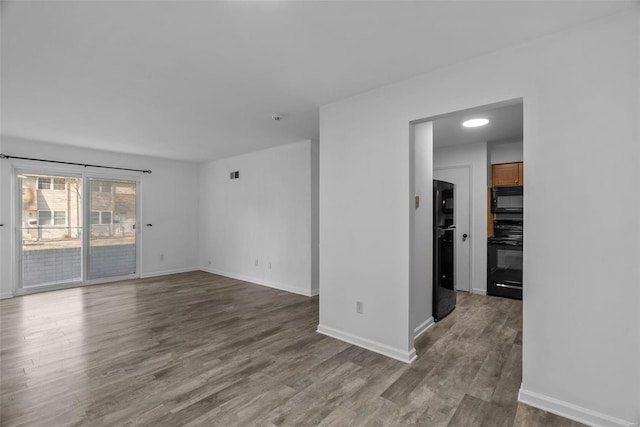 empty room featuring hardwood / wood-style floors