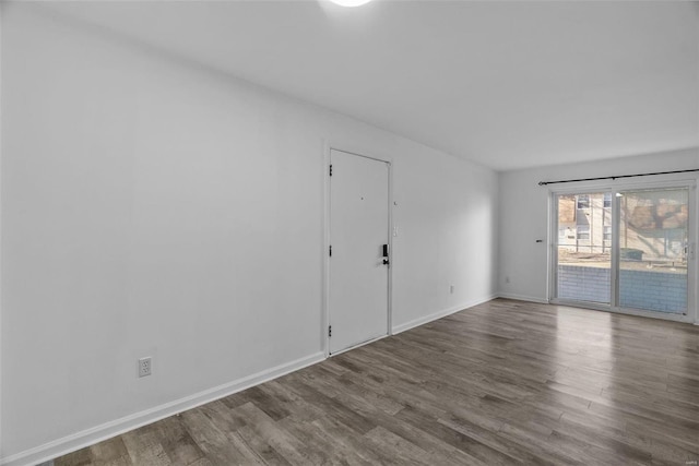 unfurnished room with hardwood / wood-style floors