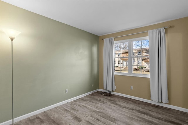 unfurnished room featuring hardwood / wood-style floors