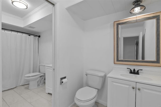 bathroom featuring crown molding, vanity, and toilet