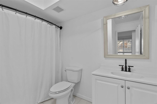 bathroom with vanity, tile patterned floors, and toilet