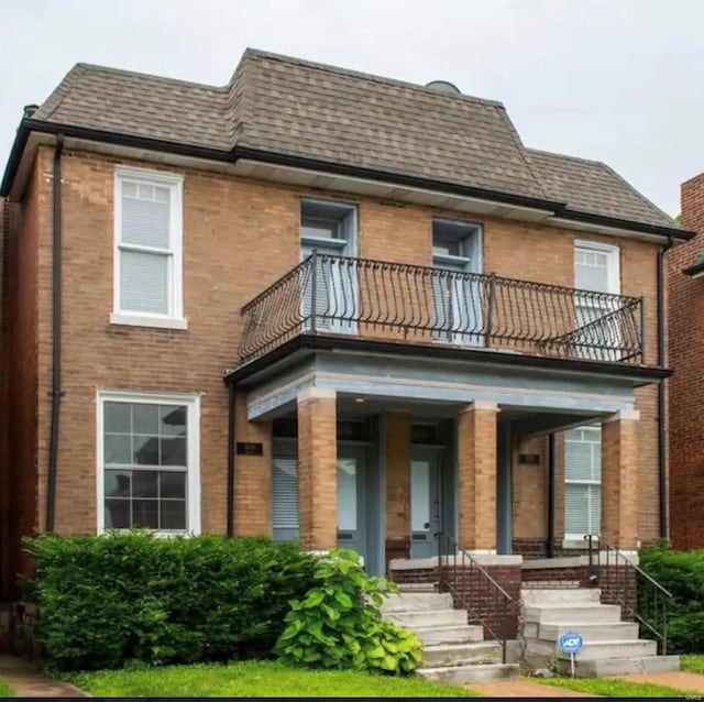 exterior space featuring a porch and a balcony