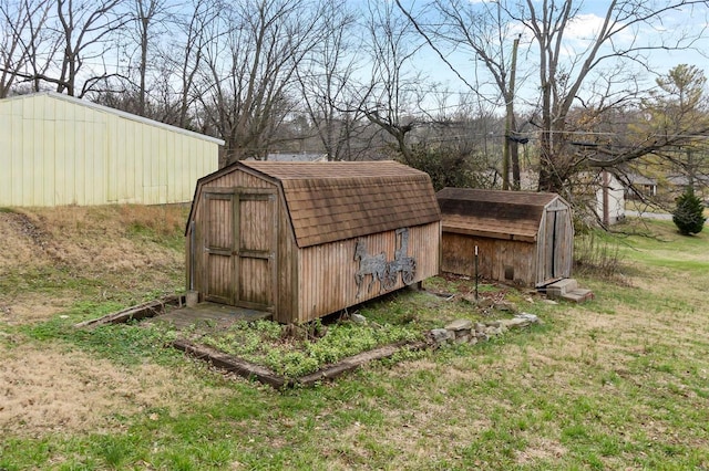 view of outdoor structure featuring a yard