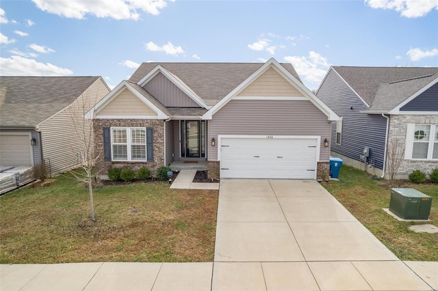 view of front of property with a front lawn and a garage