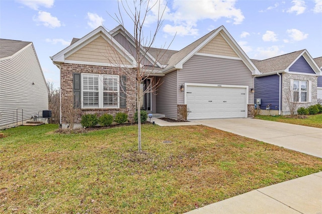 view of front of house with a garage, a front yard, and central AC