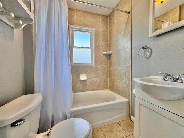 full bathroom featuring toilet, shower / tub combo, vanity, and tile patterned floors