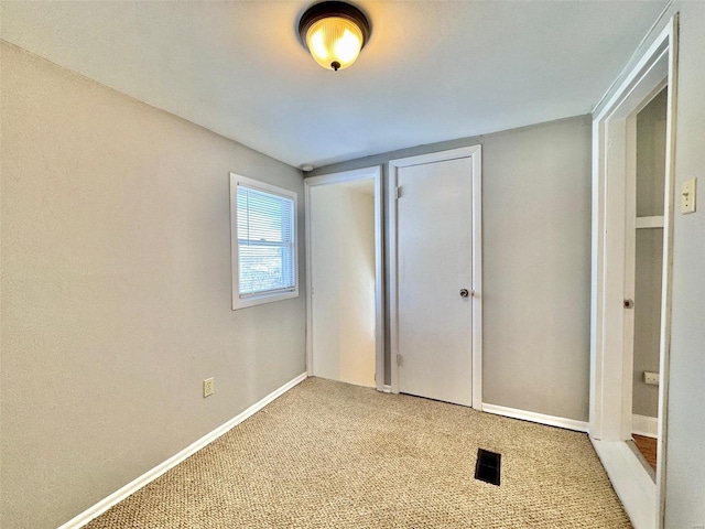 unfurnished bedroom featuring carpet floors