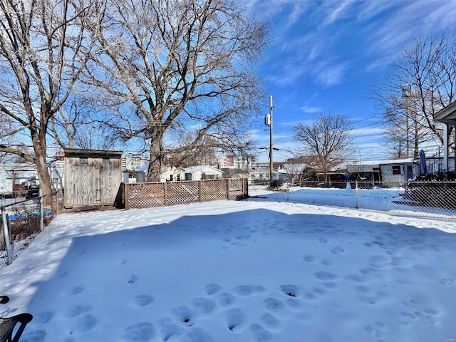 view of yard layered in snow