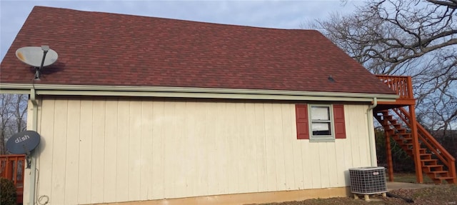 view of side of home featuring central AC unit