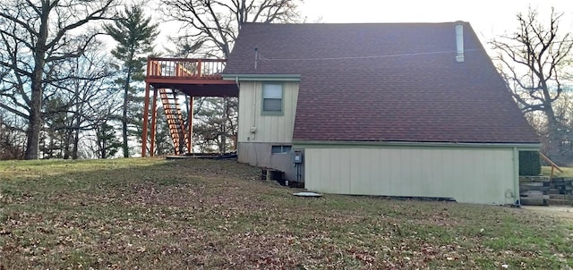 view of home's exterior with central AC, a lawn, and a wooden deck