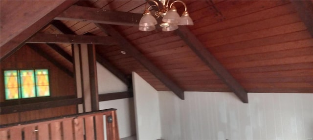 additional living space featuring lofted ceiling with beams and a chandelier