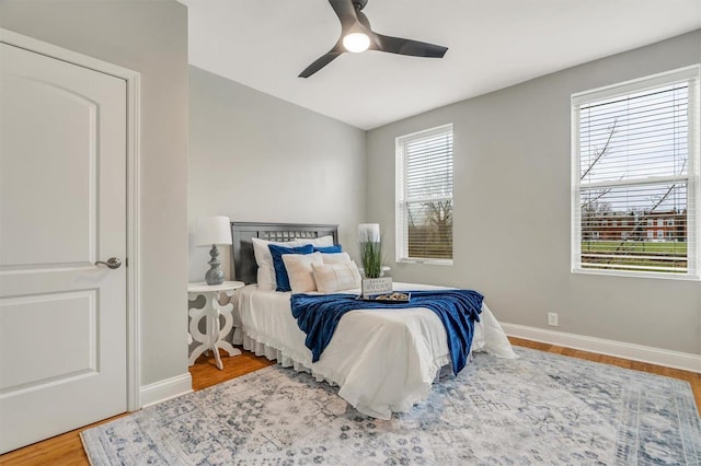 bedroom featuring ceiling fan and hardwood / wood-style flooring