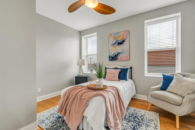 bedroom with ceiling fan and light wood-type flooring