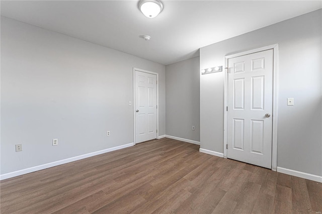 empty room with hardwood / wood-style floors