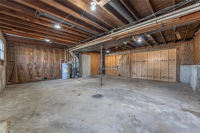 basement with electric water heater and heating unit