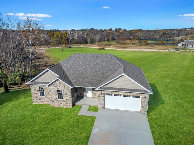 view of front facade featuring a front yard and a garage