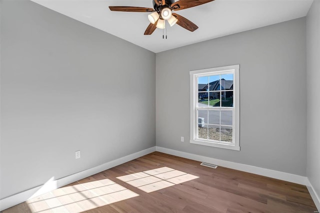 spare room with light hardwood / wood-style floors and ceiling fan