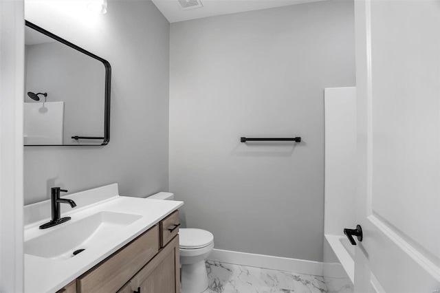 bathroom with vanity and toilet