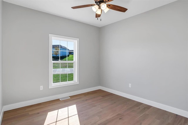 empty room with light hardwood / wood-style floors and ceiling fan