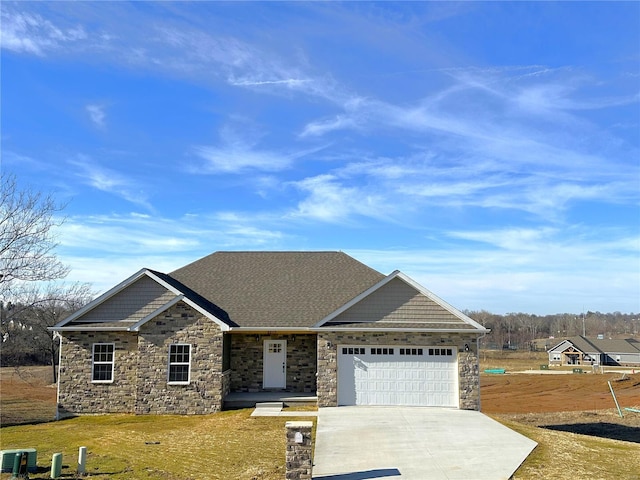 view of front facade with a garage and a front lawn