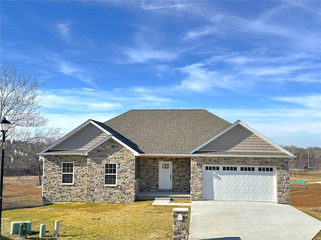 craftsman-style home featuring a garage and a front yard