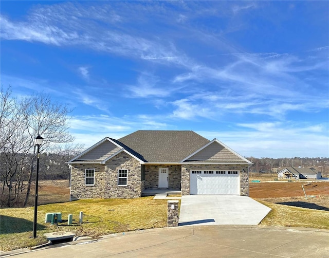 view of front of house with a garage and a front yard